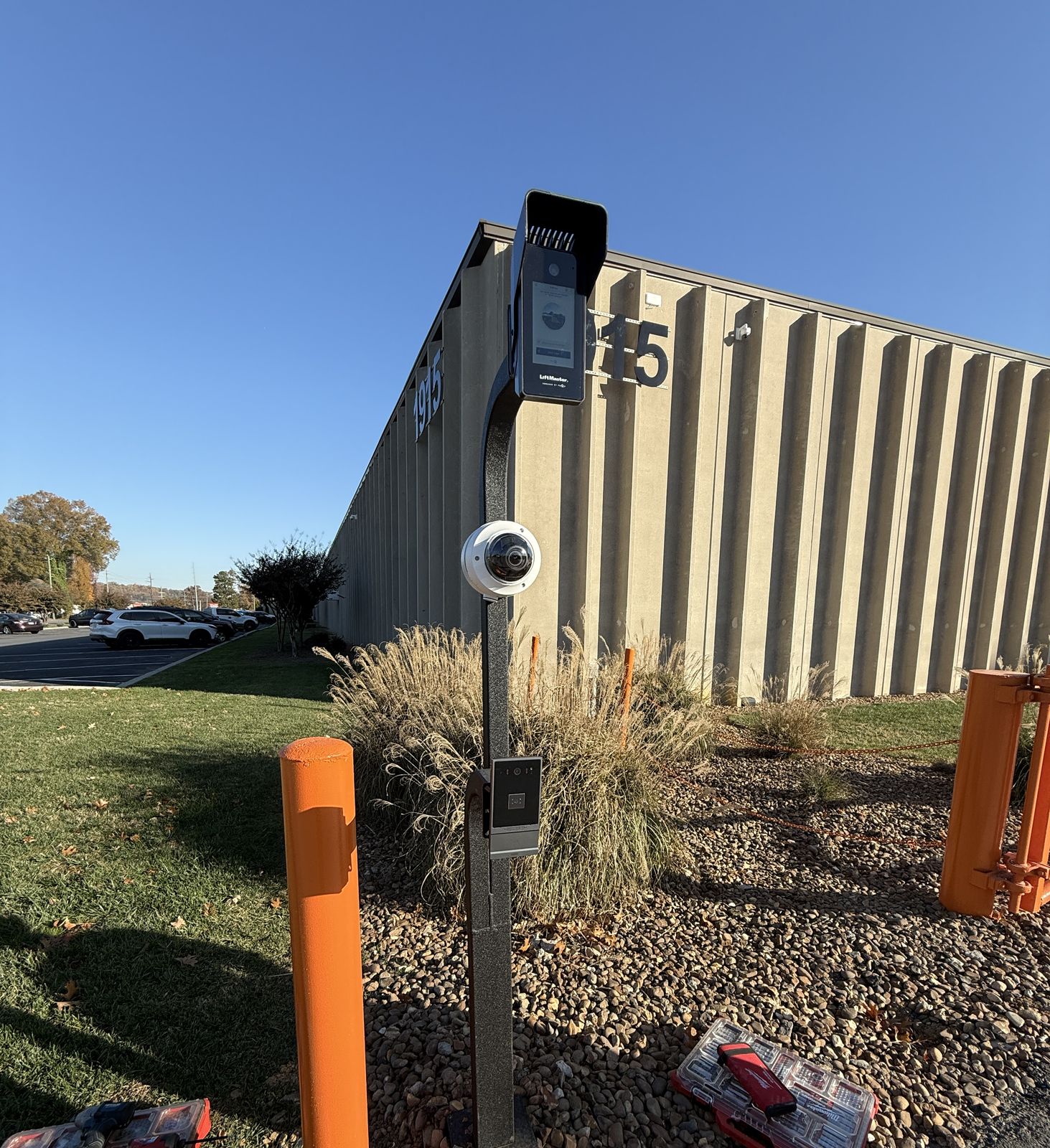 Black gooseneck access pedestal with LiftMaster video intercom and dome camera